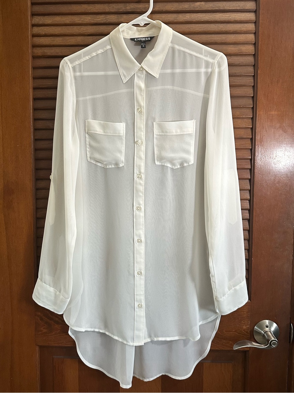 White Sheer button blouse. Dual chest patch pockets rollup sleeves, high-low hem